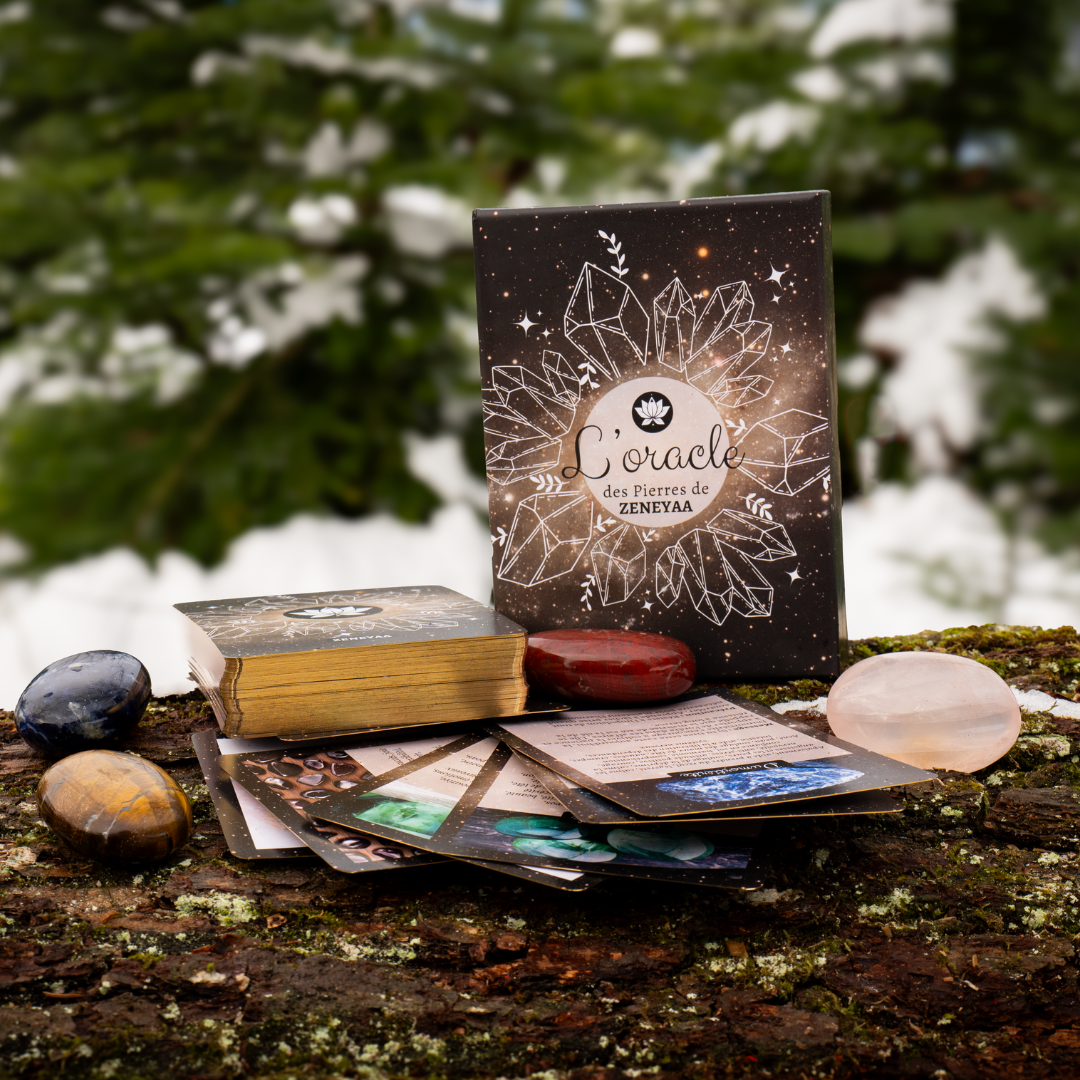 Coffret oracle de pierres posé sur une buche de bois avec du quartz